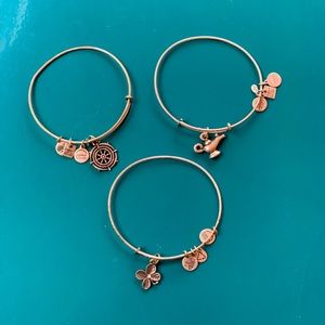 Three silver Alex and Ani bracelets